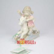 HERVIT BAMBINA SU CAVALLO A DONDOLO CM.8 Statuette in Porcellana Hervit