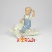 HERVIT BAMBINO PORCELLANA SU DELFINO H9 Statuette in Porcellana Hervit