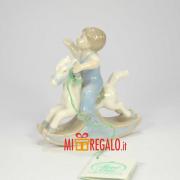 HERVIT BAMBINO SU CAVALLO A DONDOLO CM.8 Statuette in Porcellana Hervit