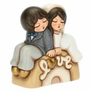 Sposini Thun seduti lu arco Love, piccoli Bomboniere