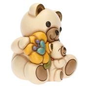 Teddy Thun primavera con cucciolo e fiore giallo Teddy Thun