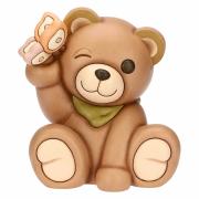 Teddy Thun primavera seduto con farfalla in mano Teddy Thun