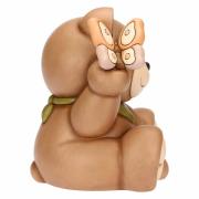 Teddy Thun primavera seduto con farfalla in mano Teddy Thun