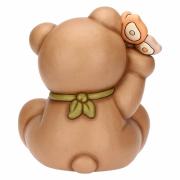 Teddy Thun primavera seduto con farfalla in mano Teddy Thun